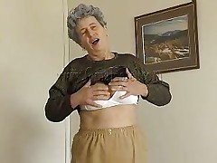 Sexy granny Rosa takes her clothes off and reveals that saggy tits of hers. She squeezes them for more pleasure and lays down on the bed. The horny old lady spreads her legs and fingers her cunt a little. She has a dildo and is ready to play with it. Wanna watch her sucking and sticking it in her pussy?